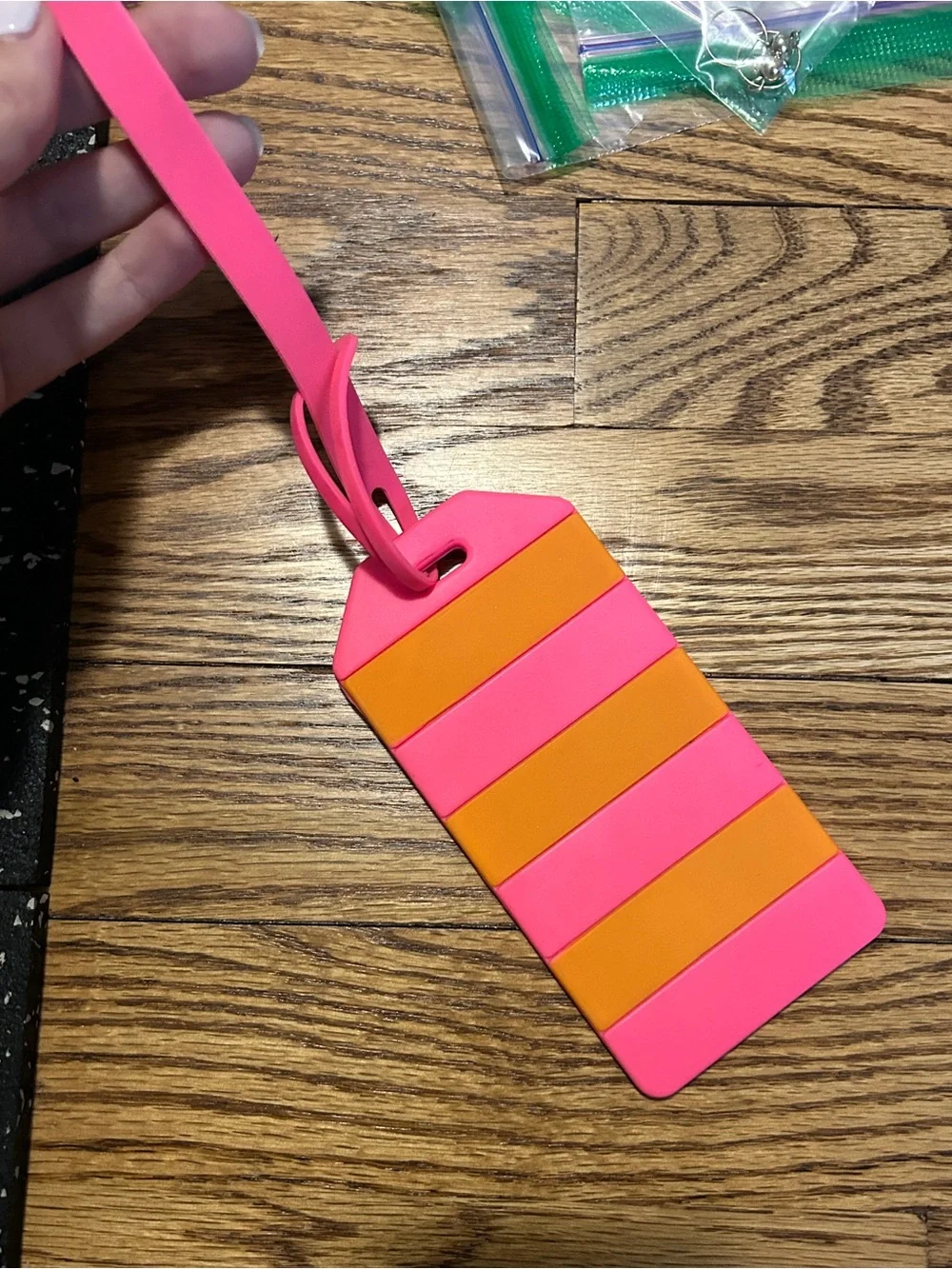 Kate Spade pink and orange luggage tag with flaw